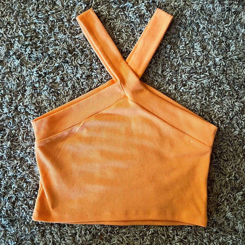 Orange criss-cross crop top.